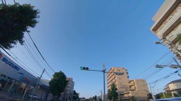 A moving cityscape at the downtown at Kanpachi avenue in Tokyo by low angle video