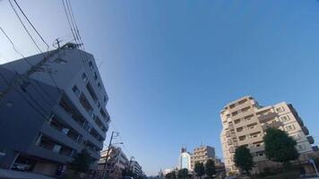 A moving cityscape at the downtown at Kanpachi avenue in Tokyo by low angle video