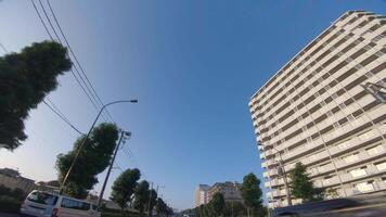 A moving cityscape at the downtown at Kanpachi avenue in Tokyo by low angle video