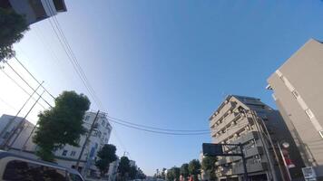 A moving cityscape at the downtown at Kanpachi avenue in Tokyo by low angle video