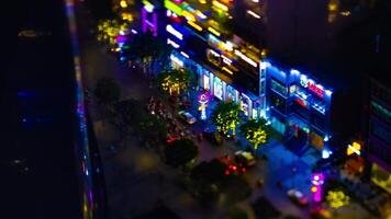 A night timelapse of miniature neon town at Nguyen Hue street in Ho Chi Minh tiltshift tilting video