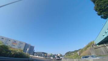 A moving cityscape at the downtown avenue in Kanagawa wide shot video