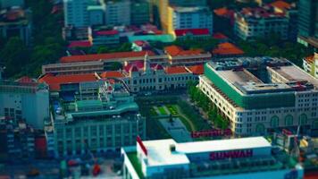 A timelapse of miniature traffic jam at Ho Chi Minh People's Committee Office Building high angle titlshift tilting video
