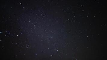 A timelapse of starry sky at night in Morocco wide shot tilt video