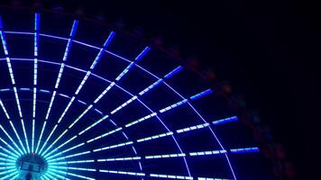 A timelapse of ferris wheel at the amusement park in Tokyo at night video