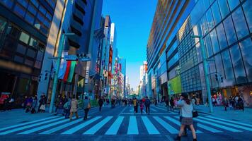 A timelapse of the city street at the downtown in Ginza Tokyo daytime wide shot panning video
