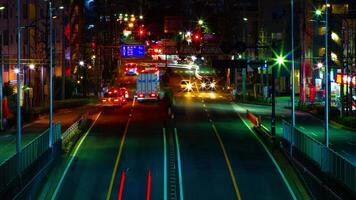 A timelapse of the street at the downtown in Tokyo at night long exposure middle shot panning video