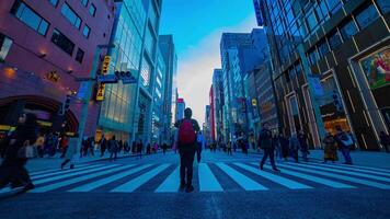 A timelapse of the city street at the downtown in Ginza Tokyo daytime wide shot tilt video