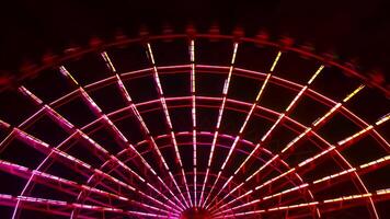 A timelapse of ferris wheel at the amusement park in Tokyo at night video