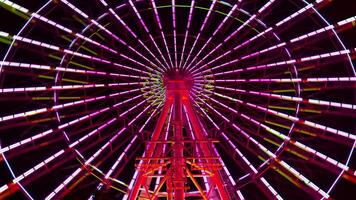 A timelapse of ferris wheel at the amusement park in Tokyo at night video