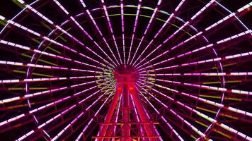 A timelapse of ferris wheel at the amusement park in Tokyo at night video