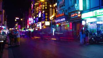 A night timelapse of the neon downtown at Bui Vien street in Ho Chi Minh Vietnam wide shot zoom video