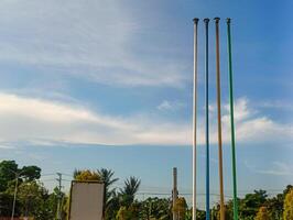Marker poles for fuel oil tanks at a fuel filling station photo