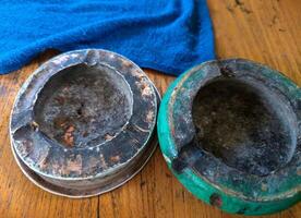 Cigarette ashtray on the table photo