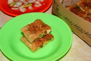 Egg martabak with sliced dish photo