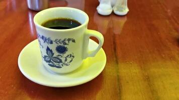 Blue white cup pot with black coffee wooden table Mexico. video