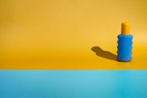 Blank sunscreen bottle on minimalist beach photo