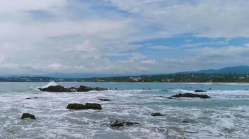 Beautiful rocks cliffs view waves at beach coast panorama Mexico. video