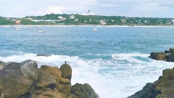 Beautiful rocks cliffs view waves at beach coast panorama Mexico. video