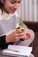 Woman starting to crochet in her online crochet classes. photo