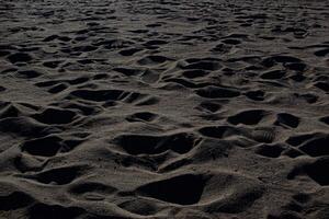 Shapes and traces in the sand of the sea. photo