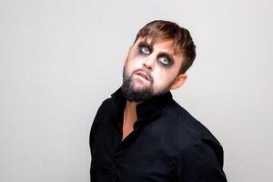 halloween makeup bearded man posing on camera photo