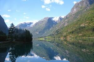 View of Geiranger fjord from the boat, Western fjords, Norway. Hardanger fjord landscape. Scandinavian mountains of Sunnylvsfjorden canyon photo