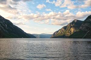 View of Geiranger fjord from the boat, Western fjords, Norway. Hardanger fjord landscape. Scandinavian mountains of Sunnylvsfjorden canyon photo