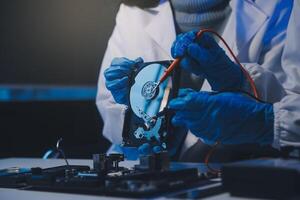 Close up of Technician measuring voltage electronic circuit board television, Service after sale fix electric equipment within insurance. photo