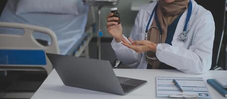 Cropped view of doctor in white coat holding bottle medication, prescribing pills to sick patient via online consultation. Family therapist recommend quality medicines. Healthcare, treatment concept photo