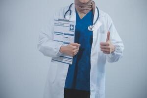 Doctor holding clipboard and stethoscope on background of Hospital ward photo