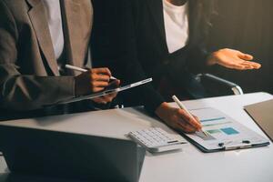 Team of business people working together in the meeting room office, teamwork background charts and graphs banner, double exposure successful teamwork,business planning concept. photo