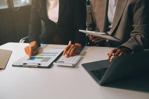 Team of business people working together in the meeting room office, teamwork background charts and graphs banner, double exposure successful teamwork,business planning concept. photo