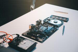 Close up of Technician measuring voltage electronic circuit board television, Service after sale fix electric equipment within insurance. photo