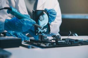 Close up of Technician measuring voltage electronic circuit board television, Service after sale fix electric equipment within insurance. photo