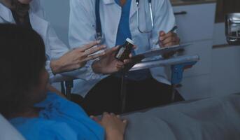 Doctor and patient discussing something while sitting at the table . Medicine and health care concept. Doctor and patient photo