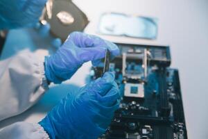 Close up of Technician measuring voltage electronic circuit board television, Service after sale fix electric equipment within insurance. photo