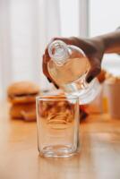 healthy beautiful young woman holding glass of water photo