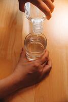 healthy beautiful young woman holding glass of water photo