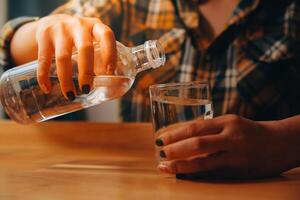 healthy beautiful young woman holding glass of water photo