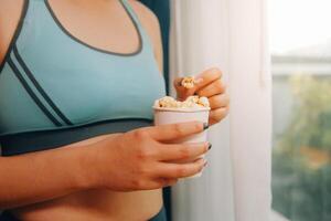 A woman holding a bowl of popcorn photo