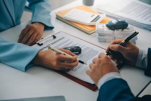 Insurance officers hand over the car keys after the tenant. have signed an auto insurance document or a lease or agreement document Buying or selling a new or used car with a car photo