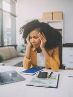 Business women are stressed while working on laptop, Tired asian businesswoman with headache at office, feeling sick at work, copy space photo