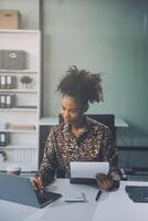 Businesswoman using calculators for do math finance on wooden desks in office and business working background, tax, accounting, statistics, and analytic research concept photo