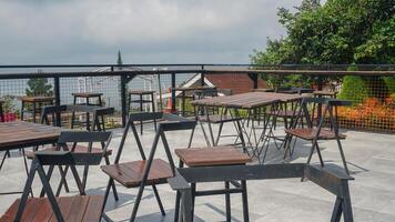 iron chair with sturdy wooden base in the garden photo