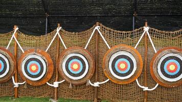 Athlete aiming at a target and shoots an arrow. Archery. photo