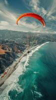 parasail floating in the sky on the sea coast photo