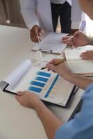 Medical Team Meeting Around Table In Modern Hospital photo