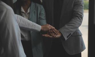 Business people shaking hands after meeting. colleagues handshaking after conference. Greeting deal, teamwork partnership cooperate concept. photo