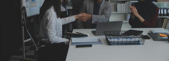 Business people shaking hands after meeting. colleagues handshaking after conference. Greeting deal, teamwork partnership cooperate concept. photo